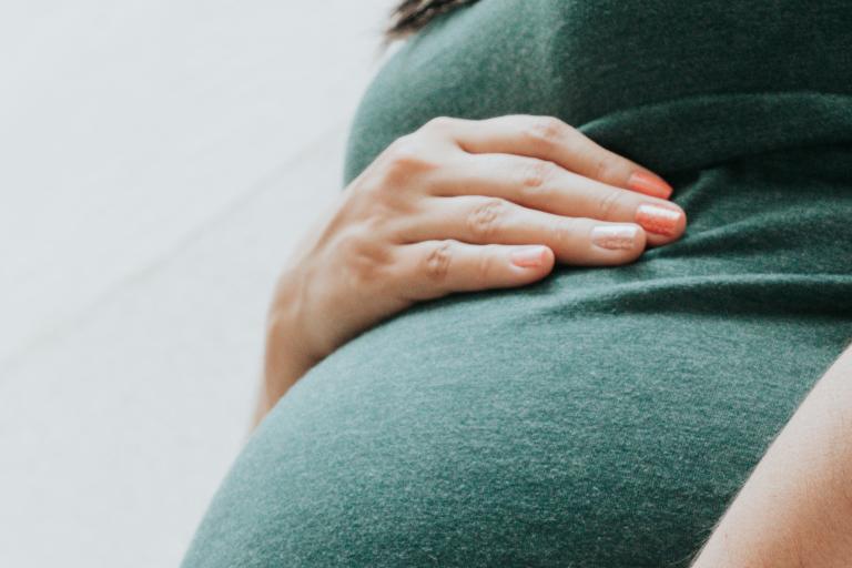Pregnant woman in a green dress